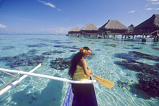 Beautiful Girl Paddling Outrigger in Tahiti